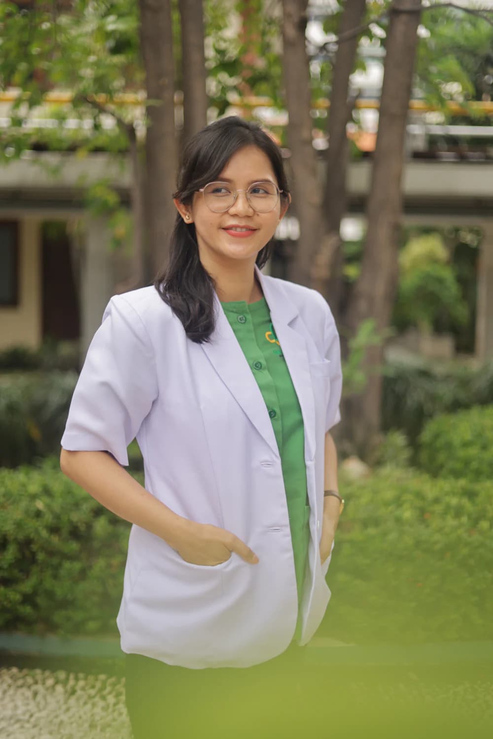 Stand-in portrait: a dietitian in a white coat outdoors